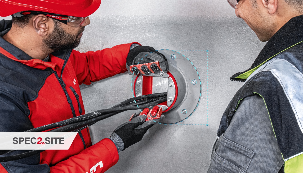 a Hilti engineer demonstrates to a customer a firestop solution for electrical installations